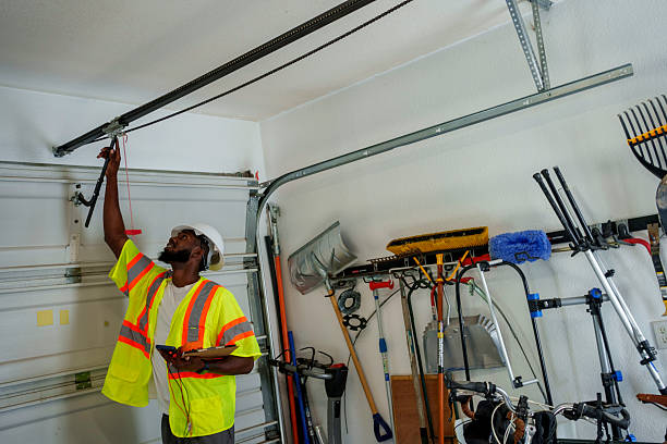 Professional Garage Door Panel Replacement technician working in West Point, UT